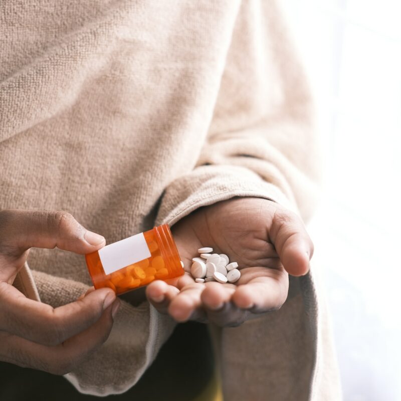 addiction pills in hand